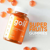 Goli Superfruits product with natural fruit background – supports skin and immunity